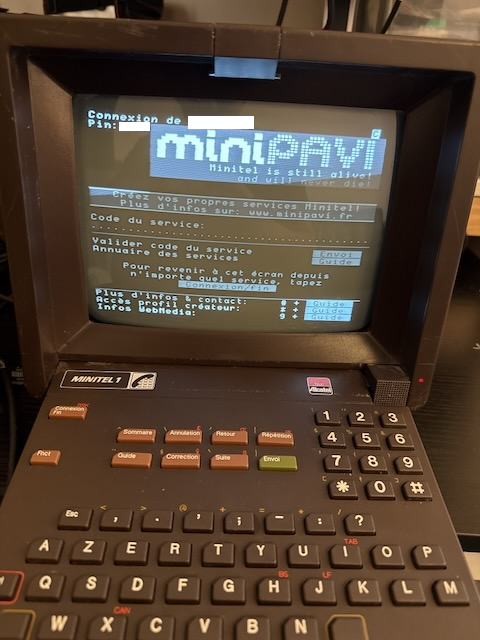 A Minitel terminal showing the MiniPavi 'home' screen, where it asks for a service code to access
